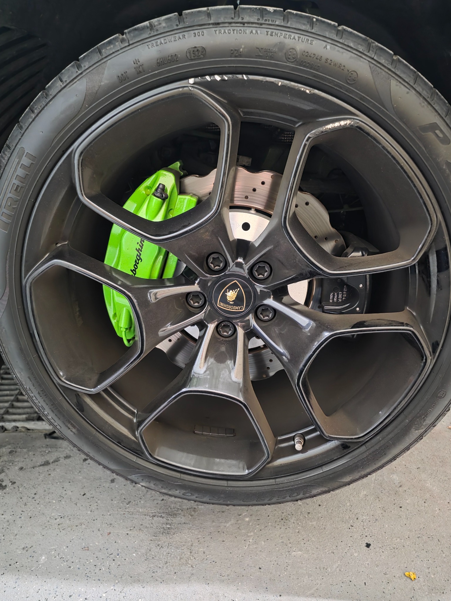Lamborghini rim before repair with visible kerb damage